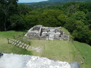 Standing to the other side of Xunantunich Temple are stone mills for grinding, with possible rainwater capture for city water, or bathing. By Cheri Majors